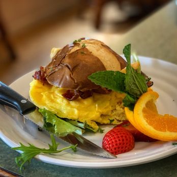 Wildflower Cafe - Breakfast Pretzel Roll-  Warmed and loaded with scrambled eggs, California pepper jack cheese and Applewood smoked bacon. - Breakfast & Brunch Near Me - Clearwater, Florida