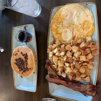 Golden Nest Pancakes & Cafe - 3 eggs, American Fries, bacon and 2 chocolate chip pancakes. - Breakfast & Brunch Near Me - Madison, Wisconsin