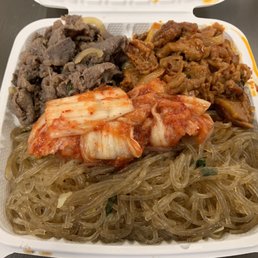 2-entrée meal (plate) with beef Bulgogi and spicy pork + a full side of japchae + Kimchi.