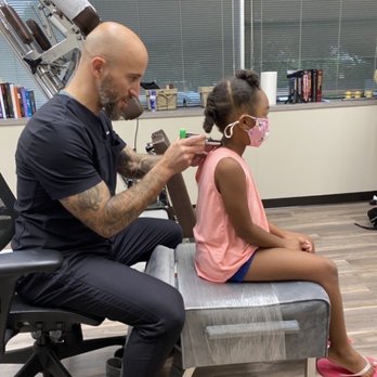 Paramount Chiropractic & Wellness - Dr. Pearlman is assessing my daughter. - Chiropractors Near Me - Richardson, Texas