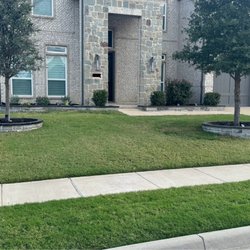 Malu's Landscape & Masonry Design - Installation of stone borders with dark topper, fresh plants and mulch, some new sod, trimmed plants and trees.