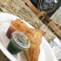 Freshly basked chicken patties served with a spicy green sauce an a sweet and sour red sauce.