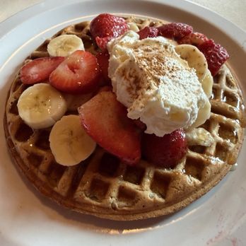 Lazy Susan Cafe - Oatmeal waffle with strawberries and bananas and whipped cream, one of their morning specials. - Waffles Near Me - Cannon Beach, Oregon Lazy Susan Cafe - Oatmeal waffle with strawberries and bananas and whipped cream, one of their morning specials. - Waffles Near Me - Cannon Beach, Oregon