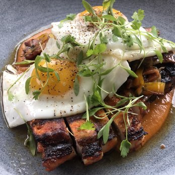 Milktooth - S&E grilled pork chop, pepper and onion hash, bacon, pineapple, sunny eggs, peach mole - Breakfast & Brunch Near Me - Indianapolis, Indiana