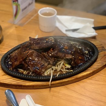 Toss Thai - a plate of food on a table - Asian Fusion Near Me - Milton, Ontario Toss Thai - a plate of food on a table - Asian Fusion Near Me - Milton, Ontario