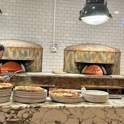 Paesano Pizza - The fired ovens in action