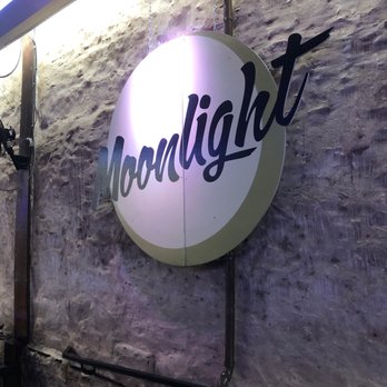 Moonlight - a neon sign on a brick wall - Wine Bars Near Me - Austin, Texas Moonlight - a neon sign on a brick wall - Wine Bars Near Me - Austin, Texas