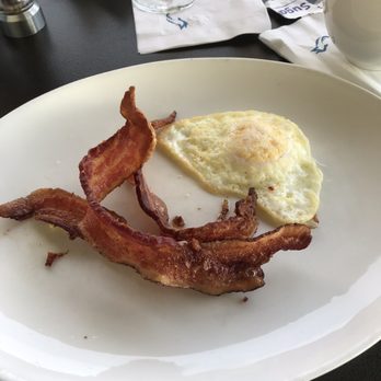 Atlantic Grille - Applewood Bacon and over medium eggs - Seafood Near Me - Palm Coast, Florida Atlantic Grille - Applewood Bacon and over medium eggs - Seafood Near Me - Palm Coast, Florida