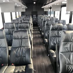 Top Fleet Limo - Interior to one of our 18-40 passenger executive shuttle style buses. Great for corporate, airport shuttle or larger group events.