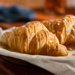 Cheddar's Scratch Kitchen - Our Honey Butter Croissants are baked to a golden brown and drizzled with house-made honey butter.