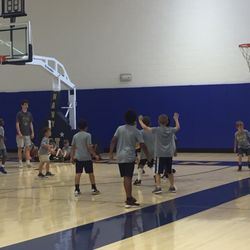 Navy Men's Basketball Camp - Little kid 5v5 where both teams wear the same color shirt.