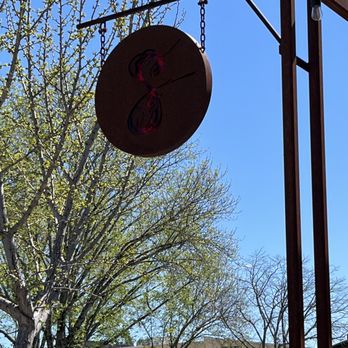 Spicy Vines - a restaurant sign hanging from a wooden structure - Wineries Near Me - Healdsburg, California Spicy Vines - a restaurant sign hanging from a wooden structure - Wineries Near Me - Healdsburg, California
