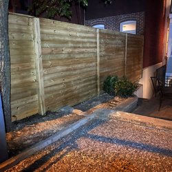 V-Tile - Horizontal pressure treat wood privacy fence.