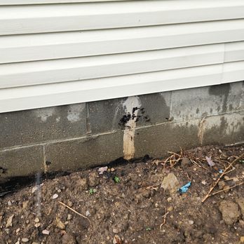 Everdry Waterproofing of Columbus - Just one photo of the tar on my concrete. I have tar on the siding too. - Waterproofing Near Me - Hilliard, Ohio Everdry Waterproofing of Columbus - Just one photo of the tar on my concrete. I have tar on the siding too. - Waterproofing Near Me - Hilliard, Ohio