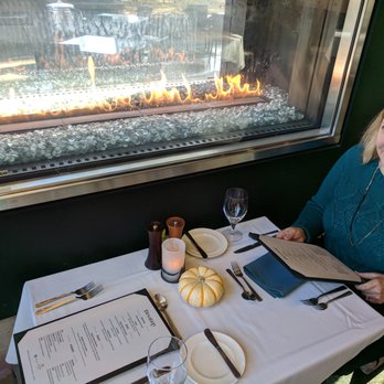 Elevation - Table by the Fireplace. - New American Near Me - Bend, Oregon