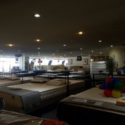 Mattress City - Amazing shopping experience. My partner is testing out beds on the bottom, left-hand corner of the image. :)