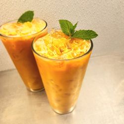 Rice N Spice - Authentic Thai Tea mixed with rich Evaporated milk and condensed milk for a smooth, creamy, and perfectly sweet balance.