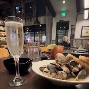 Craft House - Steamed clams paired with a glass of Prosecco - New American Near Me - Dana Point, California