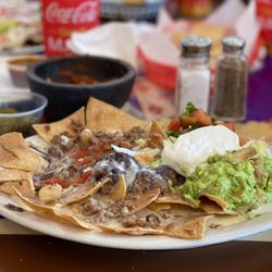 Taqueria Los Hermanos - These nachos supreme with picadillo beef will take you to another realm. SO good. YUM!