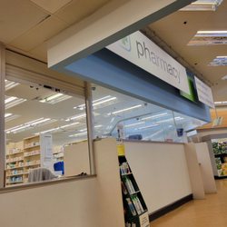 Walgreens - Pharmacy counter back of store.