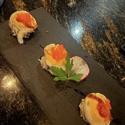 Scallops & uni on crispy rice. Scallops & uni on crispy rice.