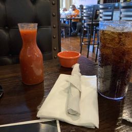 a cold drink and a menu a cold drink and a menu