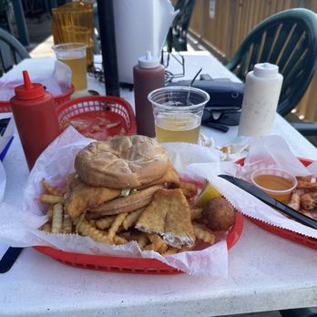 Our Deck Down Under - Catch of the Day Fried Fish Sandwich with half pound peel and eat spicy shrimp. - Seafood Near Me - Port Orange, Florida