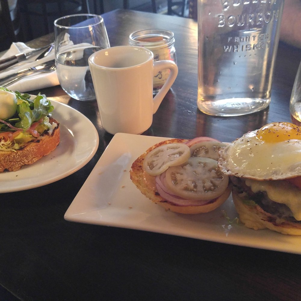 Schout Bay Tavern - Avocado Toast on the Left, SBT Burger with an Egg on the right. I'm not mad at it! It was really tasty and well cooked. - New American Near Me - Manhasset, New York Schout Bay Tavern - Avocado Toast on the Left, SBT Burger with an Egg on the right. I'm not mad at it! It was really tasty and well cooked. - New American Near Me - Manhasset, New York
