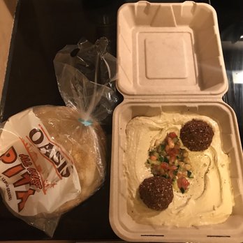 Oasis Kitchen - Hummus plate with falafel, and an open bag of "Oasis" store bought pita that came with my order. - Falafel Near Me - Oakland, California