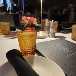 Cute little light on the table, with a tiny poinsettia plant
