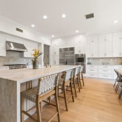 Preferred Home Builders - Sophisticated Kitchen Remodel with a Warm, Clean Look by Preferred Home Builders in Calabasas, CA