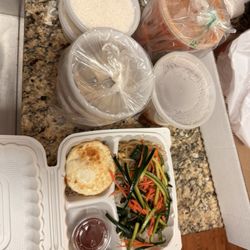 Korean Mart - Here's everything that I got with two sides of rice. Even the bibimbop is the majority of rice. Under those vegetables is all rice.