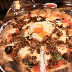 Fiora Pizzeria - Sheepdog pizza special ordered with an over easy egg and house made siriacha