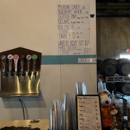 a beer tap and a menu a beer tap and a menu