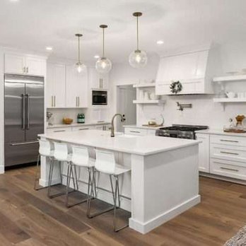 Mr J Remodeling - a kitchen with white cabinets and stainless steel appliances - General Contractors Near Me Mr J Remodeling - a kitchen with white cabinets and stainless steel appliances - General Contractors Near Me