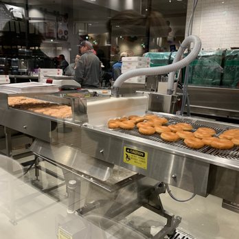 Krispy Kreme - Fresh donuts being glazed. - Donuts Near Me - Utica, Michigan Krispy Kreme - Fresh donuts being glazed. - Donuts Near Me - Utica, Michigan