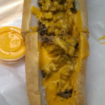 Chubby's Cheesesteaks - Top view with steak and cheese wiz. - American Near Me - West Milwaukee, Wisconsin Chubby's Cheesesteaks - Top view with steak and cheese wiz. - American Near Me - West Milwaukee, Wisconsin