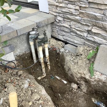Framework Construction & Remodeling - Under cut the pavers to make room for dead valves they should have cut or removed. - General Contractors Near Me Framework Construction & Remodeling - Under cut the pavers to make room for dead valves they should have cut or removed. - General Contractors Near Me