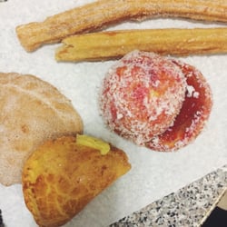 Navarro Bakery - (Left) cream empanadas and pecan empanadas. Churros on top. Yoyo de fresas to the middle.