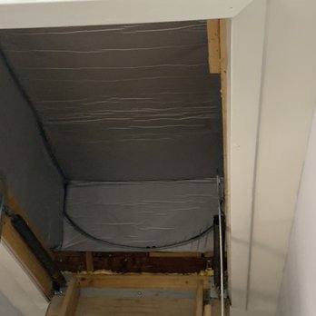 Attic Air - Attic door tent installed by Attic Air - An attic hatch opening shows the ceiling frame and partially exposed attic space with insulation and wiring. - Insulation Installation Near Me - St. Charles, Illinois
