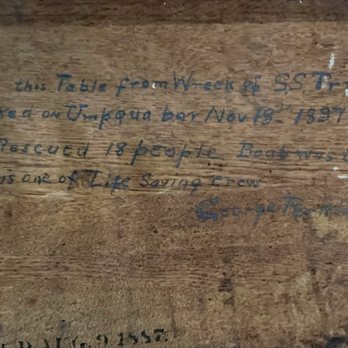 Umpqua River Lighthouse Museum - Writing found under a table recovered from a shipwreck - Museums Near Me - Winchester Bay, Oregon