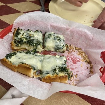Manny's Pizza House VI - Half order of spinach bread (2 slices already devoured) - Pizza Near Me - Port Orange, Florida