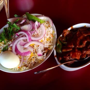 Biryani Pot - You can only see onion and white rice - Indian Near Me - Houston, Texas