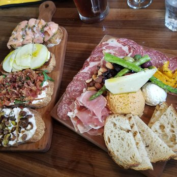 Postino Heights - Butchers board, bruchetta (salmon and pesto, apple and brie, burrata and bacot and tomato, ricotta and pistachio) - Wine Bars Near Me - Houston, Texas Postino Heights - Butchers board, bruchetta (salmon and pesto, apple and brie, burrata and bacot and tomato, ricotta and pistachio) - Wine Bars Near Me - Houston, Texas