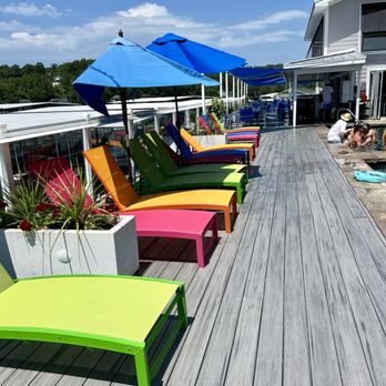 Boathouse Lakeside Bar & Grill - Lounge chairs pool-side - American Near Me - Eldon, Missouri