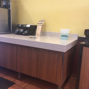 El Pollo Loco - The disinfectant cleaning solution on top of the counter closed to the soda machine and also where they keep the lids for the drinks. - Mexican Near Me - Concord, California