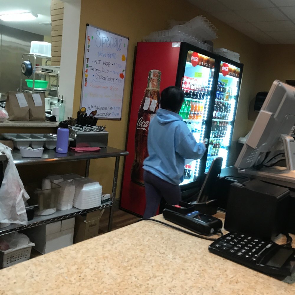 Palermo Pizza - a woman at a counter in a restaurant - Italian Near Me - Paisley, Florida Palermo Pizza - a woman at a counter in a restaurant - Italian Near Me - Paisley, Florida