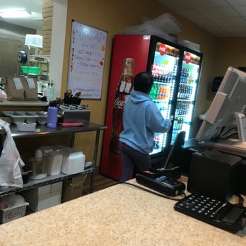 Palermo Pizza - a woman at a counter in a restaurant - Italian Near Me - Paisley, Florida Palermo Pizza - a woman at a counter in a restaurant - Italian Near Me - Paisley, Florida