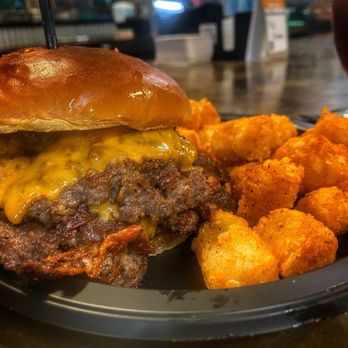 Mad Beach Craft Brewing - "The Kraken Burger" 2 1/4 lb patties w/ Bacon, Monterey Jack, ranch seasoning. Lettuce, tomato, onion & lagered sour cream brioche bun - Breweries Near Me - Madeira Beach, Florida