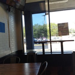 Stoner's Pizza Joint - Clean and spacious dining room with TV. Watching the Simpsons right now while eating pizza.
